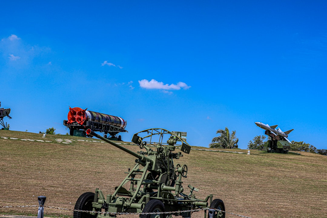 Military equipment is on display with a blue sky.
