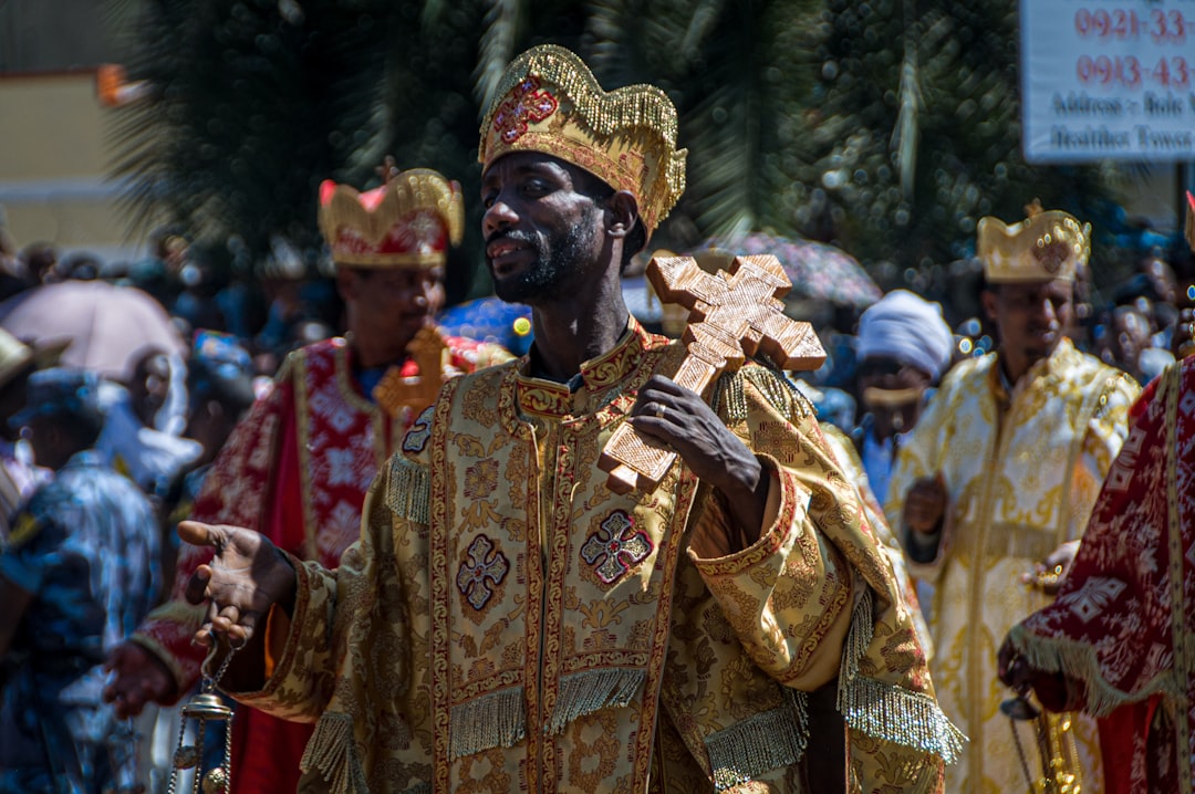 a man dressed in a gold and red costume