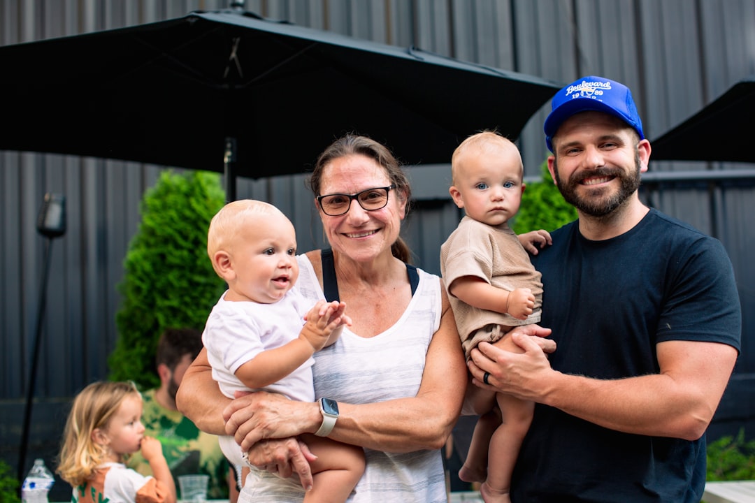 A man and a woman holding a baby in their arms