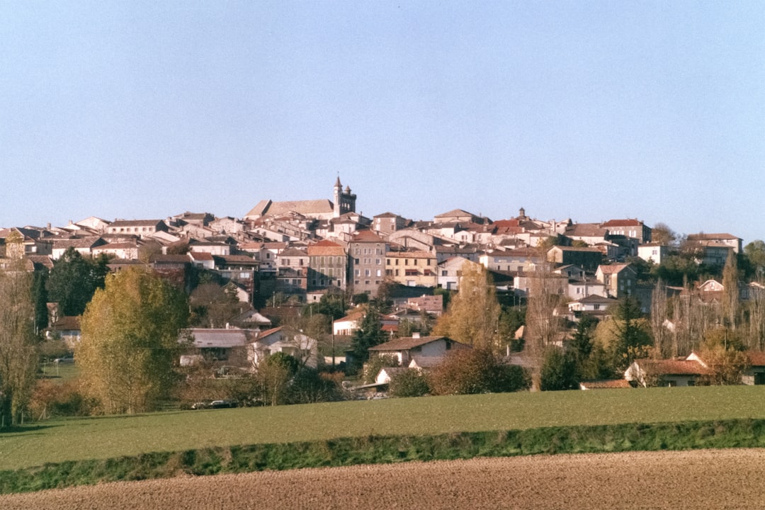 A picturesque french village nestled on a hillside.