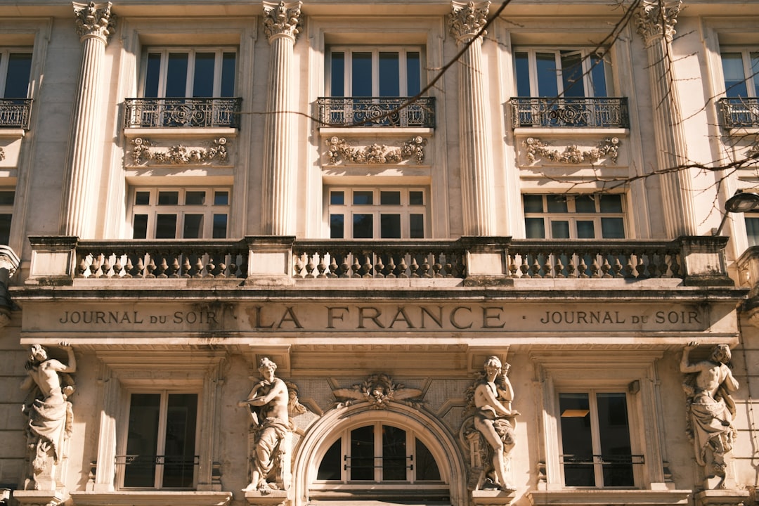 Ornate building facade with statues and balconies
