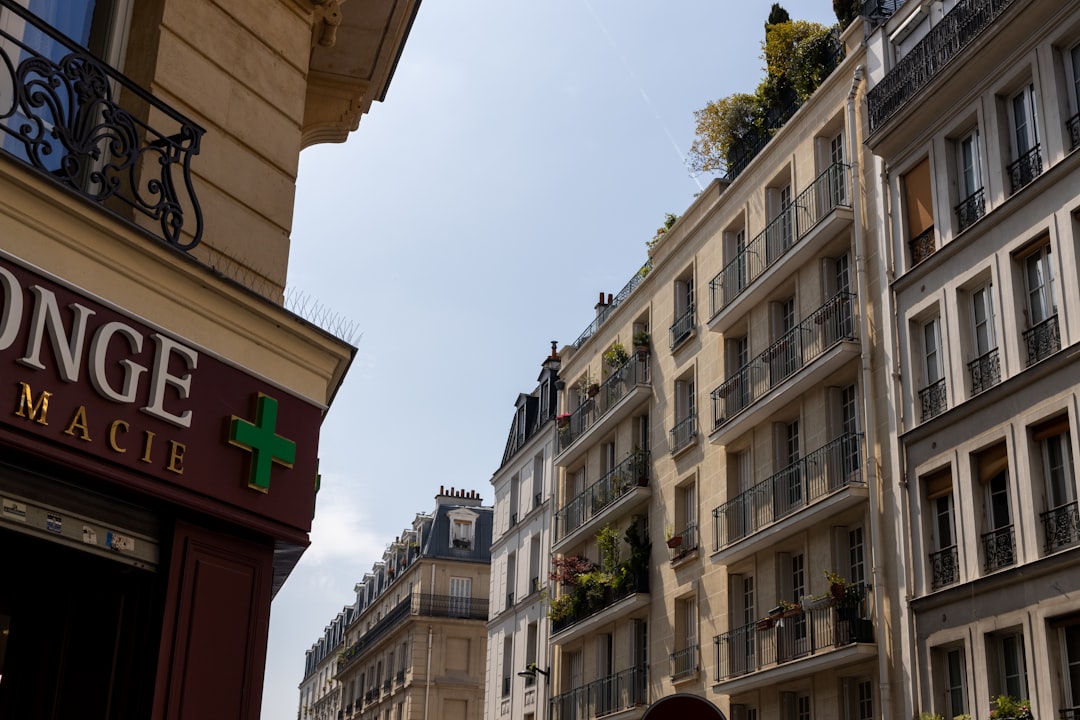 a building with a green cross on the front of it