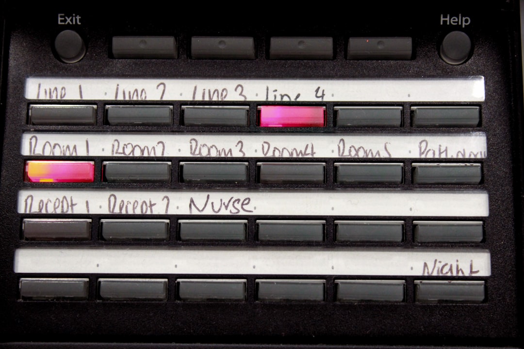 Buttons labeled with handwritten text on a control panel.