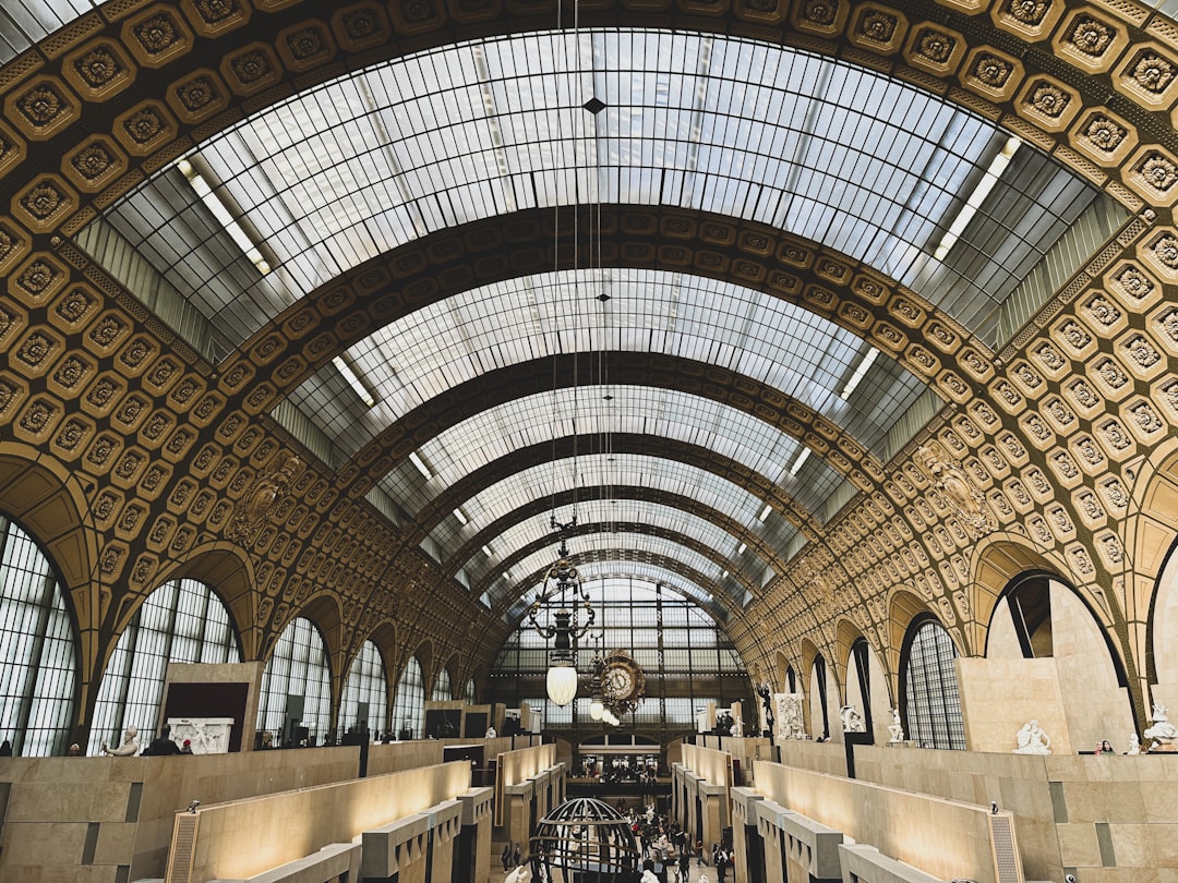a train station with a lot of people inside of it